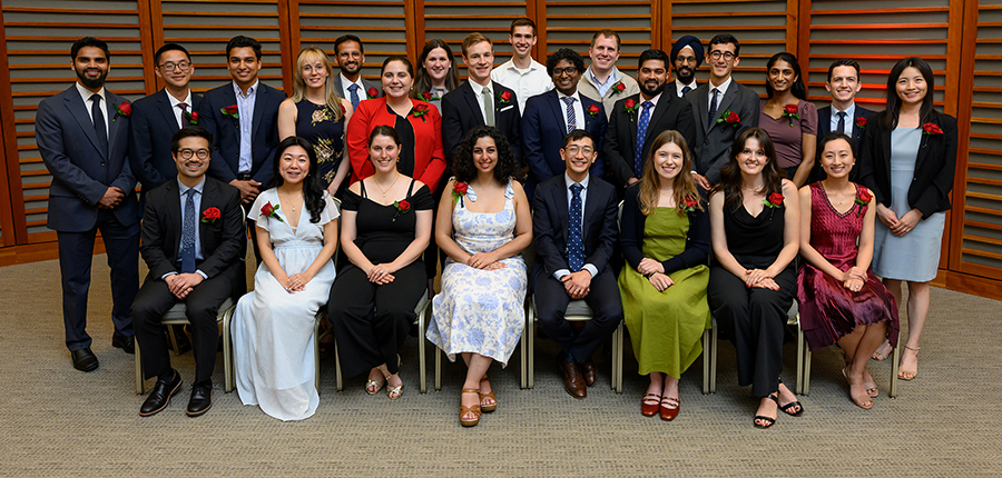 Members of the MD-PhD Class of 2025 pose for a photo at their graduation dinner, held May 27 at the Veritas Science Center.