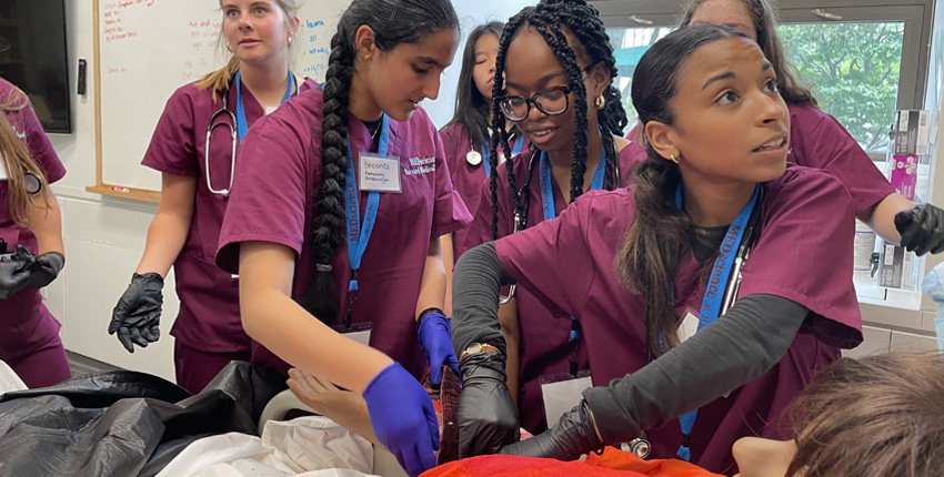 Students working on a patient simulator