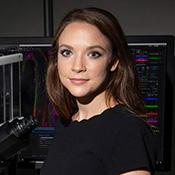 Woman smiling softly.