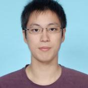 Man wearing classes looking at the camera.